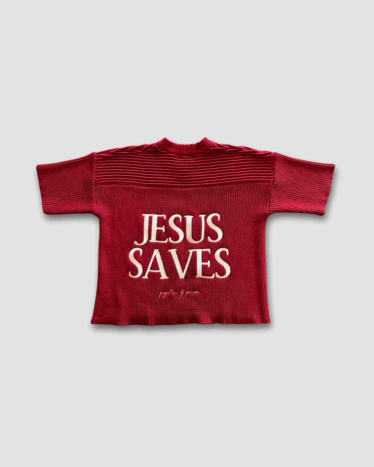 Red ribbed sweater with 'Jesus Saves' text on a light gray background