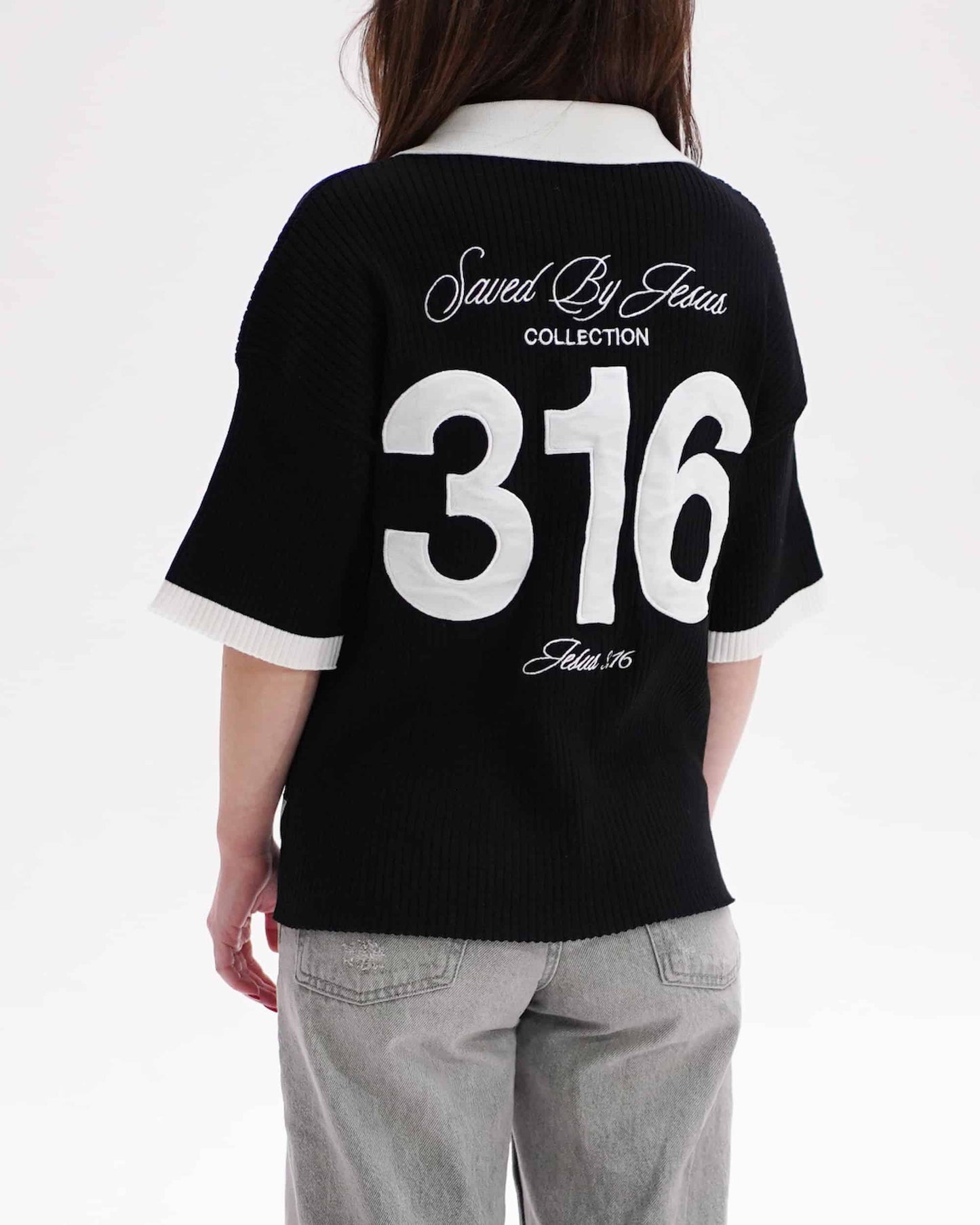 Person wearing a black jersey with 'Saved By Jesus Collection 316' text on the back.