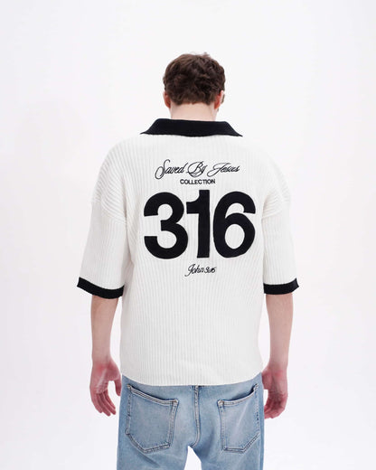 Person wearing a white polo shirt with black text and numbers on the back, standing against a white background.